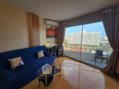 Spacious living room with stunning city view and cozy balcony access