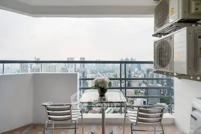 Stunning high-rise balcony with city skyline view, perfect for relaxation and enjoying urban living.