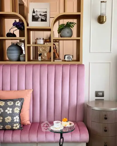 Chic living room with pink velvet seating and elegant decor accents