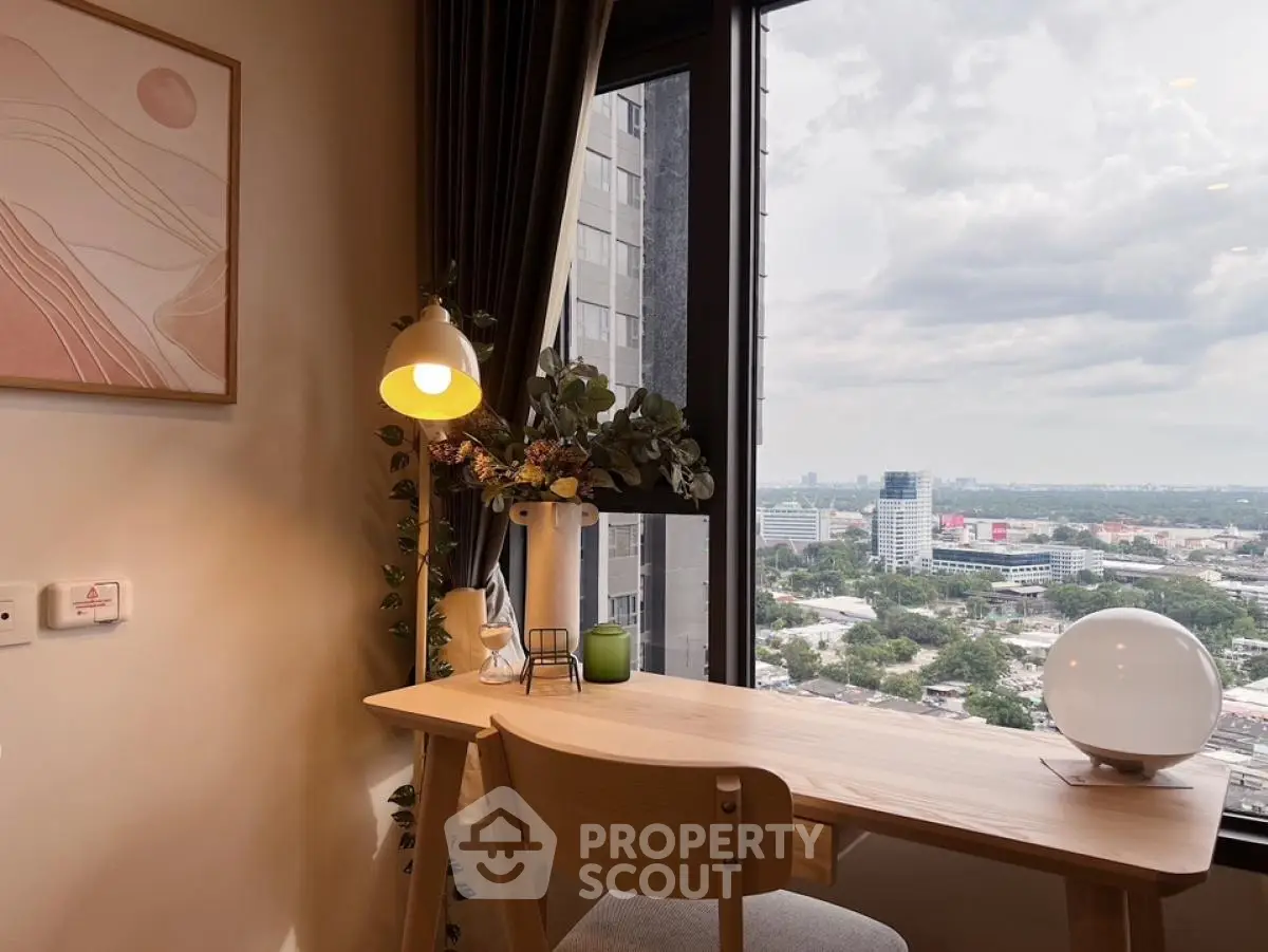 Modern study nook with city view, stylish desk, and elegant decor