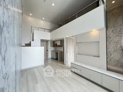 Modern loft apartment with high ceilings and sleek marble accents
