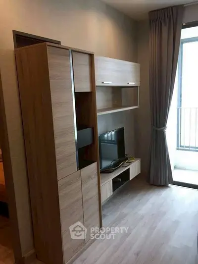 Modern living room with sleek wooden furniture and natural light