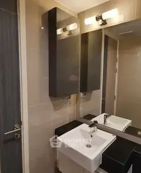Modern bathroom with sleek fixtures and stylish lighting