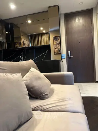 Modern living room with plush sofa and elegant decor
