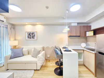 Modern open-layout kitchen and living room with stylish decor and natural light