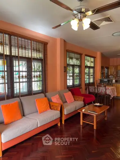 Spacious living room with vibrant decor and open layout, perfect for family gatherings.