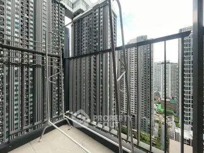High-rise balcony with cityscape view, perfect for urban living enthusiasts.