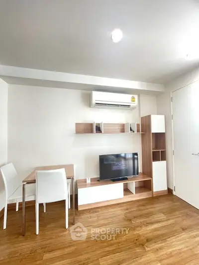 Modern living room with sleek furniture and air conditioning, perfect for cozy urban living.