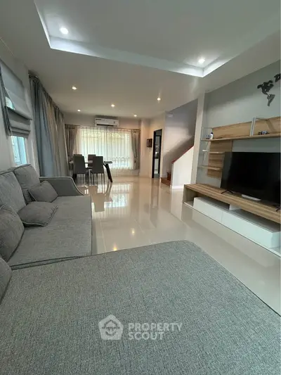 Spacious modern living room with elegant decor and ample natural light