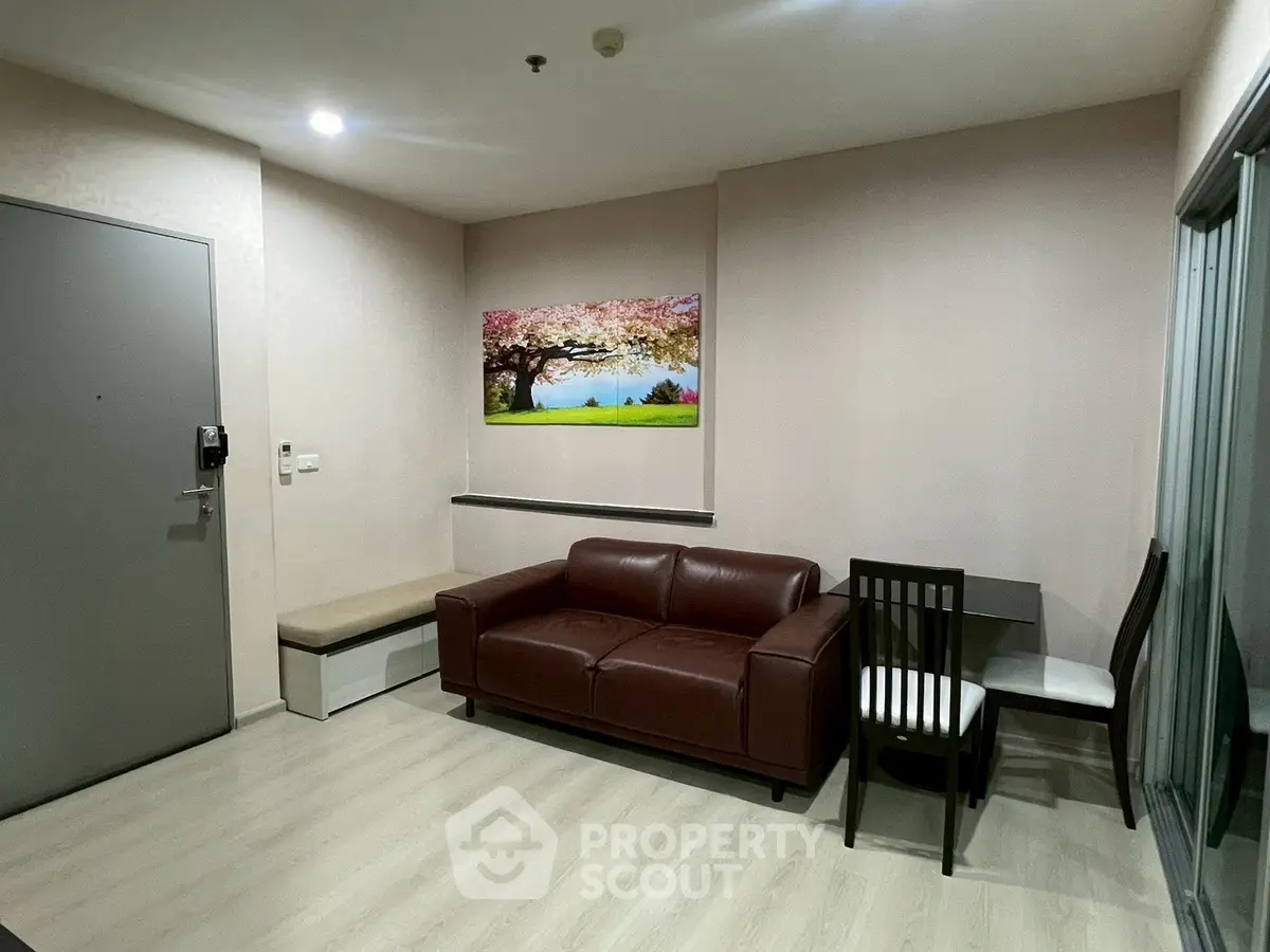 Modern living room with brown leather sofa and stylish wall art