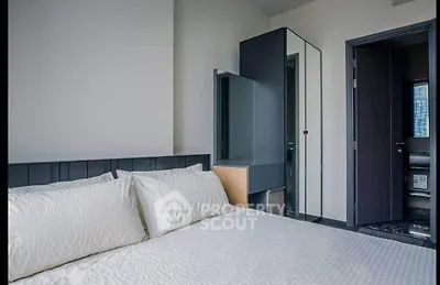 Modern bedroom with sleek design and mirrored wardrobe