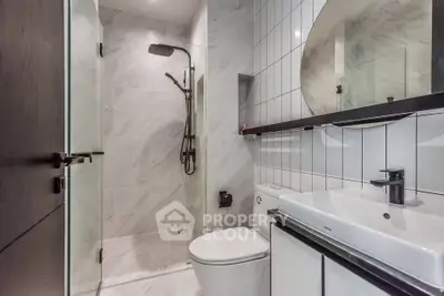 Modern bathroom with sleek shower and elegant fixtures