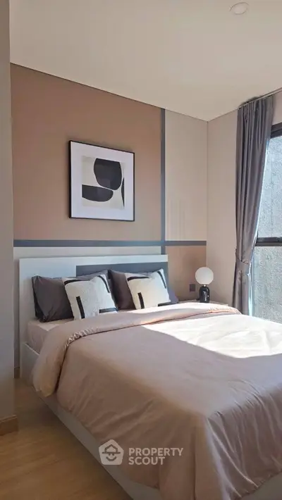 Modern bedroom with stylish decor and natural light
