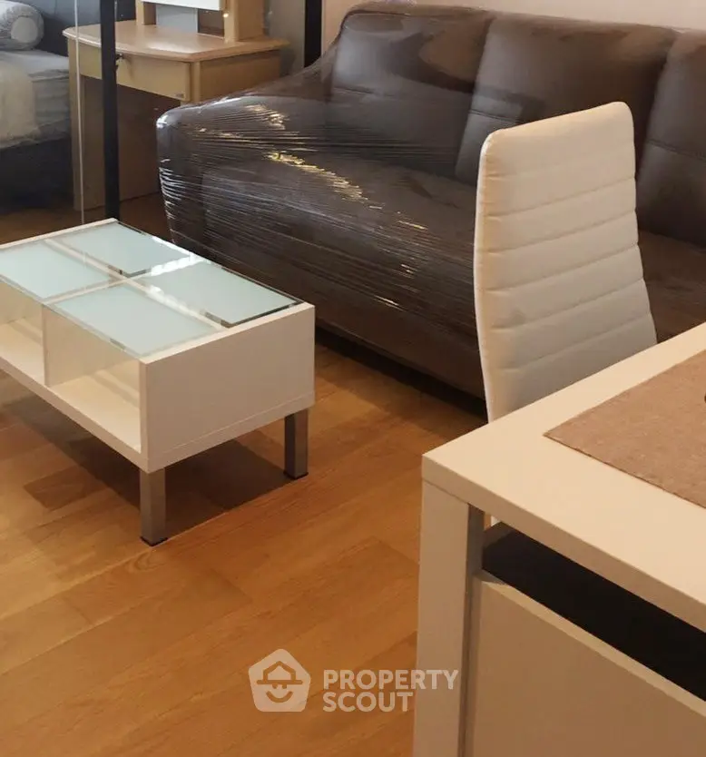 Modern living room with sleek furniture and wooden flooring