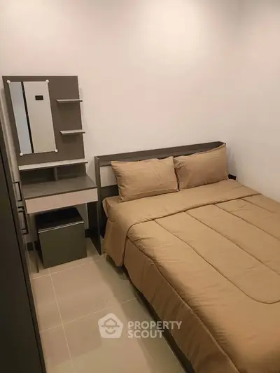 Cozy bedroom with modern furnishings and neutral tones, perfect for relaxation and comfort.