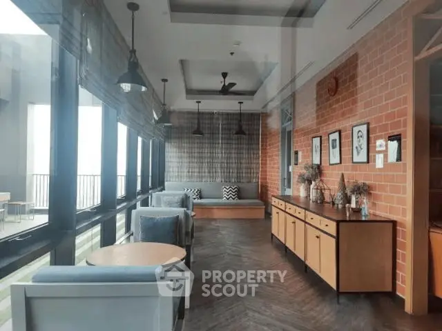 Stylish modern living room with brick walls and large windows