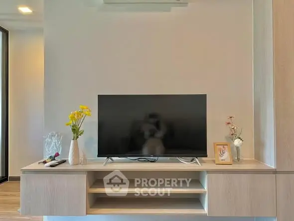 Modern living room with sleek TV setup and stylish decor