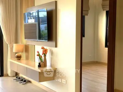 Modern living room with wall-mounted TV and elegant decor
