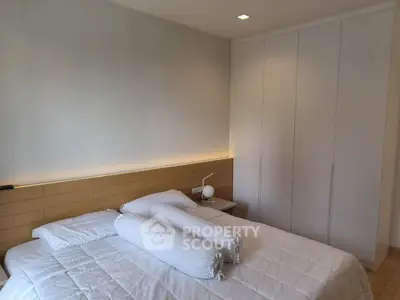 Modern bedroom with sleek design and ample storage space