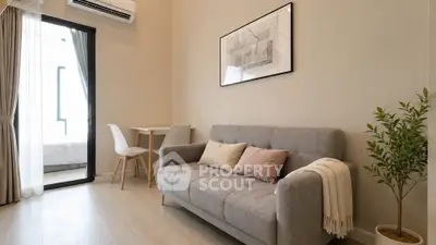 Modern living room with cozy sofa, stylish decor, and natural light