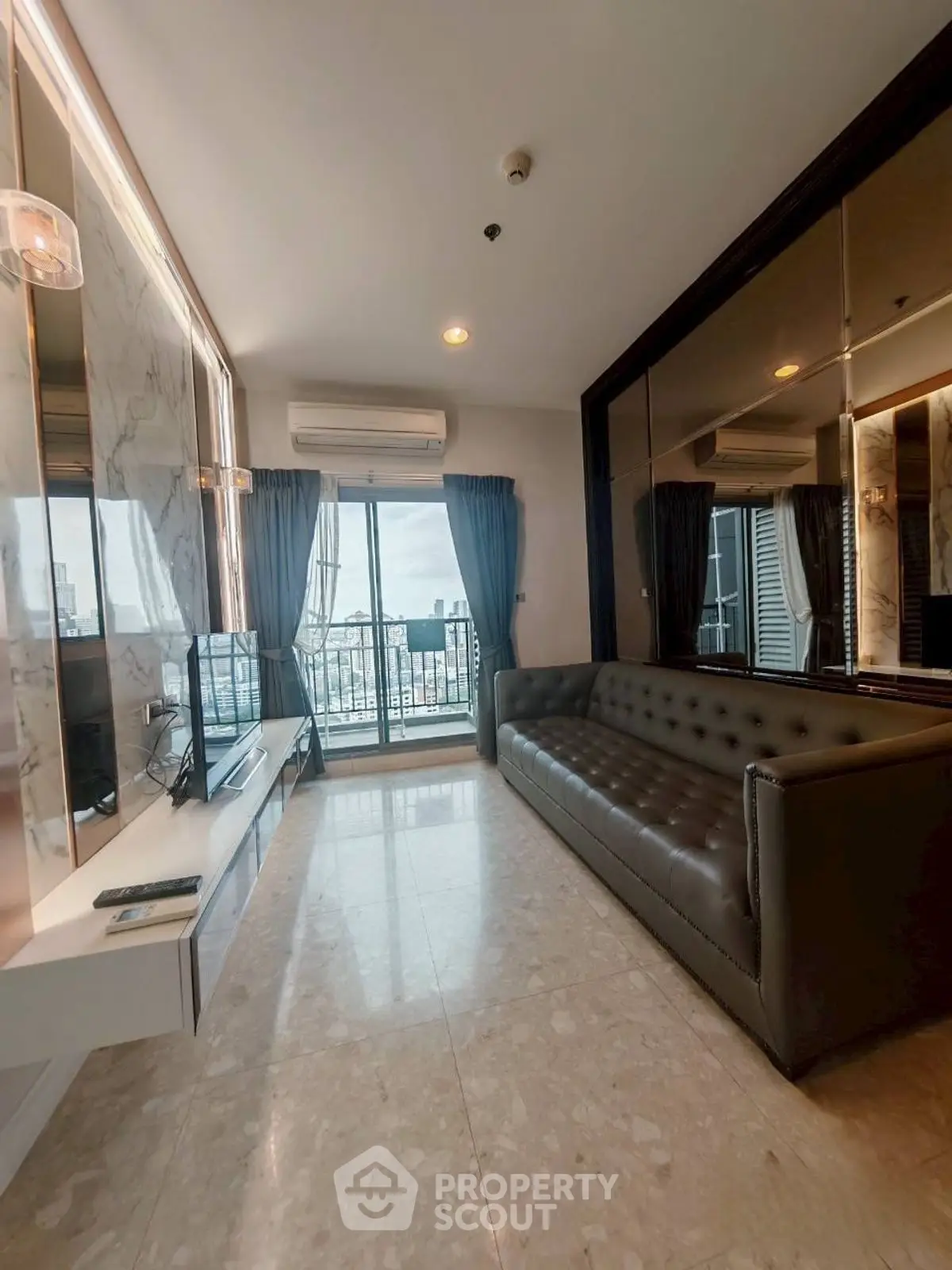 Luxurious living room with modern decor and city view balcony