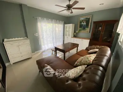 Charming living room with vintage furniture and natural light, perfect for cozy gatherings.