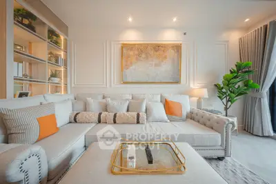 Luxurious living room with elegant decor and plush seating in modern apartment.
