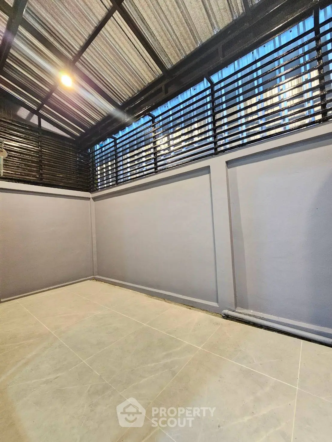 Spacious enclosed balcony with modern design and ample natural light