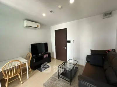Cozy living room with modern furniture and air conditioning in a stylish apartment.