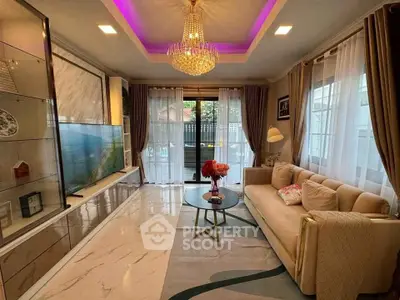 Luxurious living room with elegant chandelier and modern decor