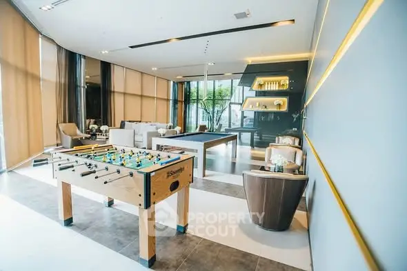 Luxurious modern living room with foosball table and elegant decor