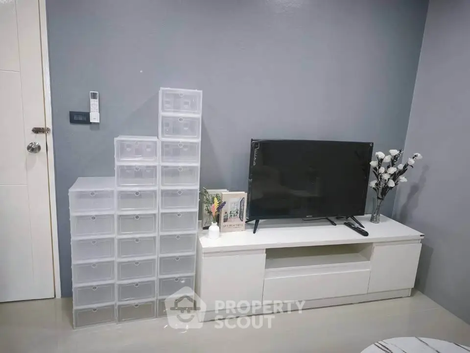 Modern living room with sleek TV stand and storage drawers