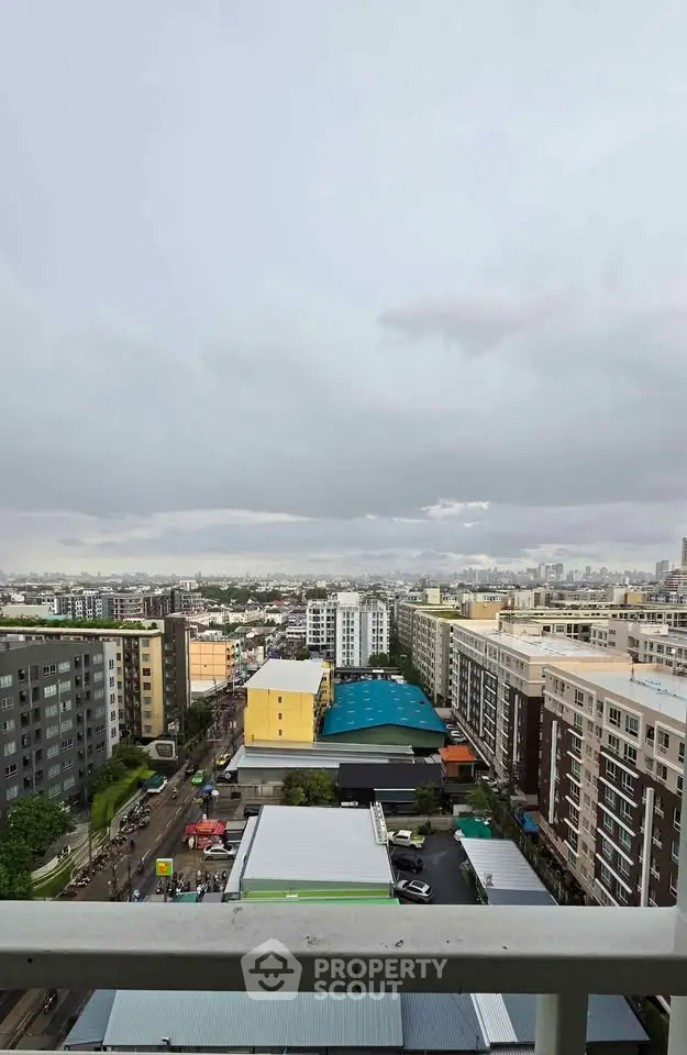 Stunning cityscape view from a high-rise balcony showcasing urban living and skyline.
