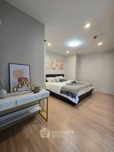 Spacious modern bedroom with elegant decor and cozy ambiance