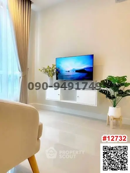 Modern living room with wall-mounted TV and elegant decor