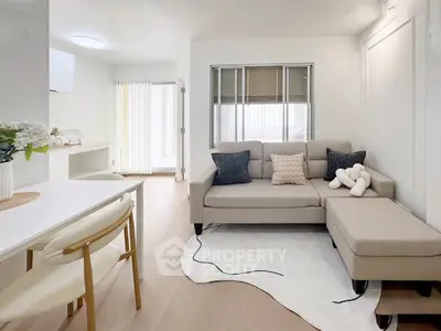 Modern living room with stylish furniture and natural light