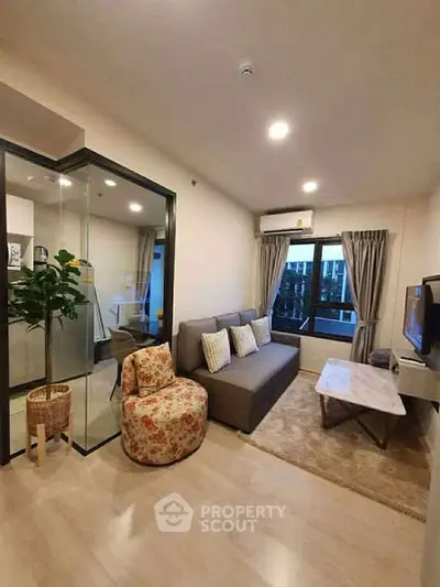 Modern living room with cozy sofa and stylish decor in a contemporary apartment.