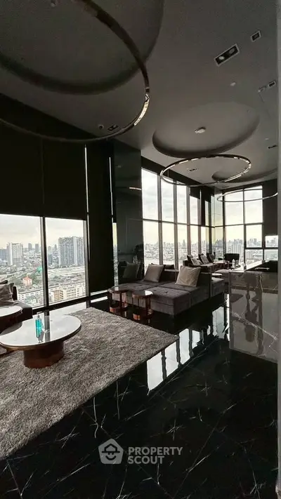 Luxurious high-rise living room with panoramic city views and modern decor