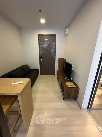 Cozy living room with modern furniture and TV setup