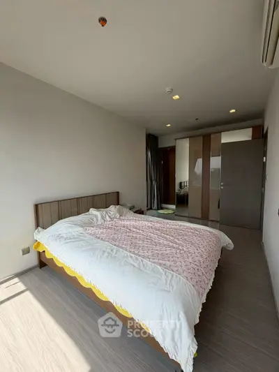 Spacious bedroom with modern design and ample natural light