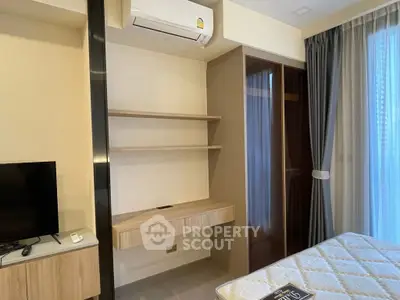 Modern bedroom with built-in shelves and air conditioning unit