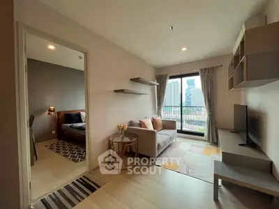 Modern apartment living room with city view, cozy sofa, and stylish decor