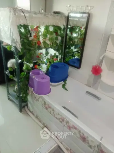 Charming bathroom with floral decor and bathtub, ideal for relaxation.