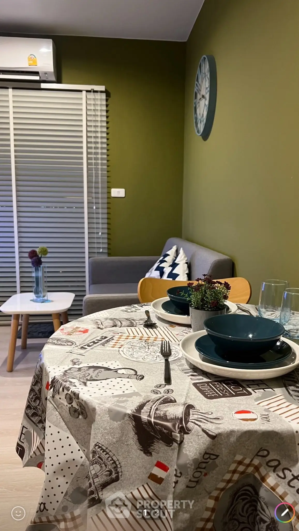 Cozy living room with dining area, stylish decor, and modern furnishings.