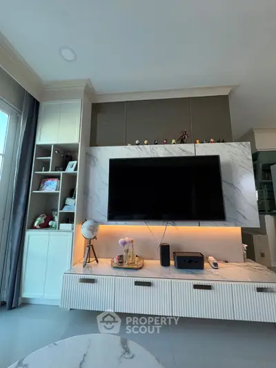 Modern living room with sleek TV unit and elegant decor