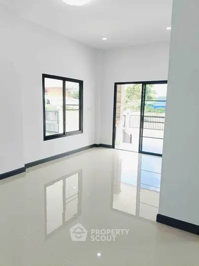 Spacious empty room with large windows and glossy tiled floor, perfect for customization.