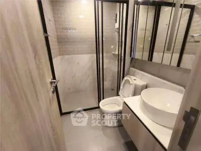 Modern bathroom with sleek design and glass shower enclosure