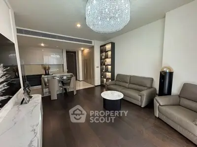 Luxurious modern living room with elegant chandelier and stylish furniture