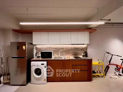 Modern kitchen with sleek appliances and stylish cabinetry