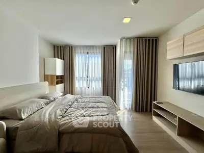 Spacious modern bedroom with natural light and stylish decor